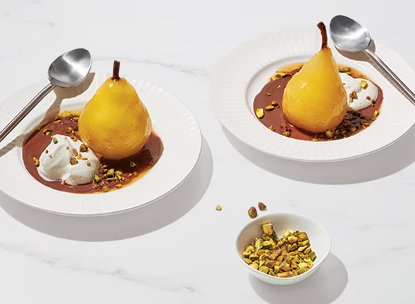 Champagne-Poached Pears with Chocolate Crème Anglaise and Pistachios