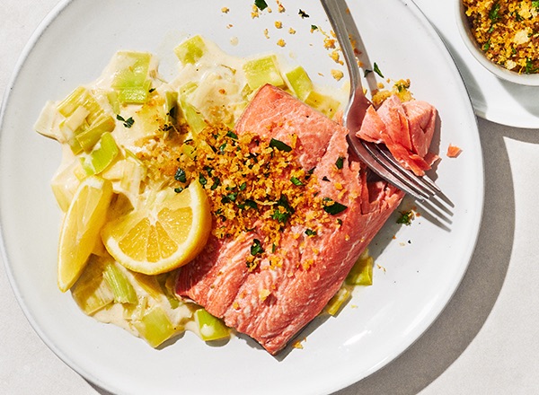 Poaching is an amazing way to enjoy Alaskan salmon. Explore the restaurant-quality flavors you can make in your own kitchen with this Poached Salmon with Creamed Leeks and Toasted Lemon Gremolata recipe.