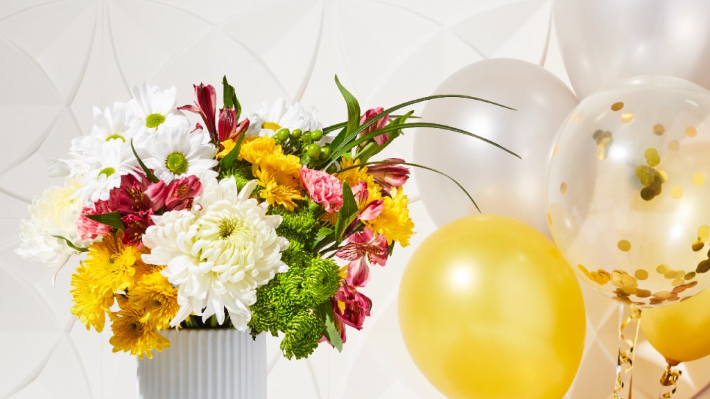 Graduation celebration floral arrangement and balloons