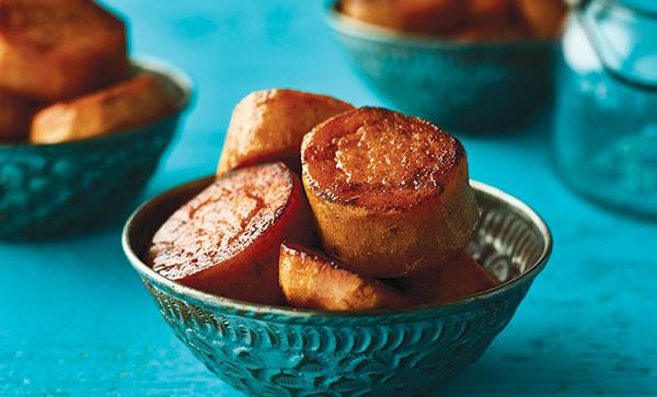 bowls of cut and spiced sweet potatoes