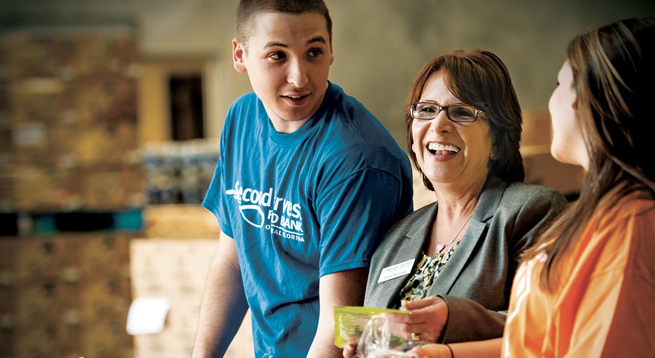 publix charities volunteers smiling at a food bank