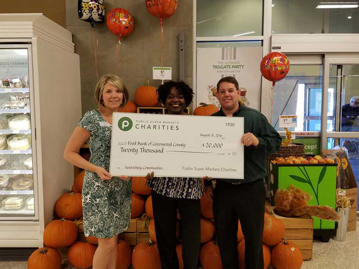 public charities check presentation to food bank of greenwood county for $20,000