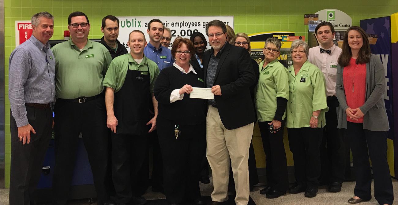 publix charities presents check to united way of wilson county