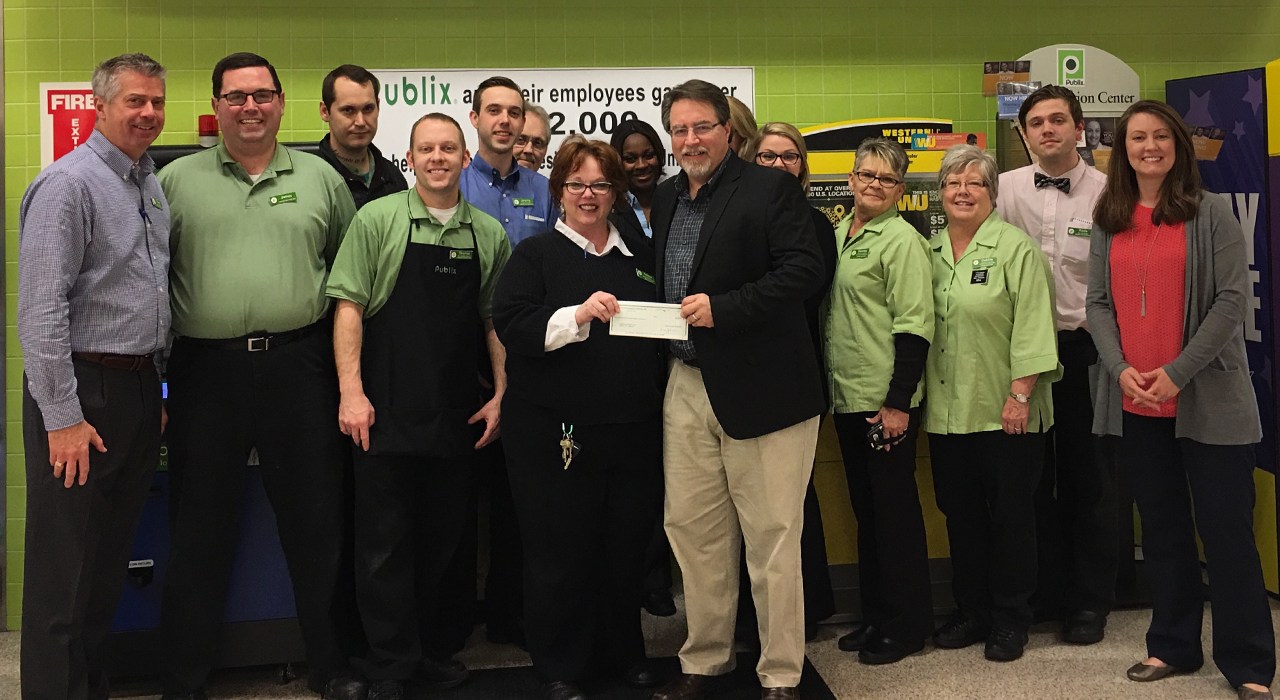 publix charities presents check to united way of wilson county