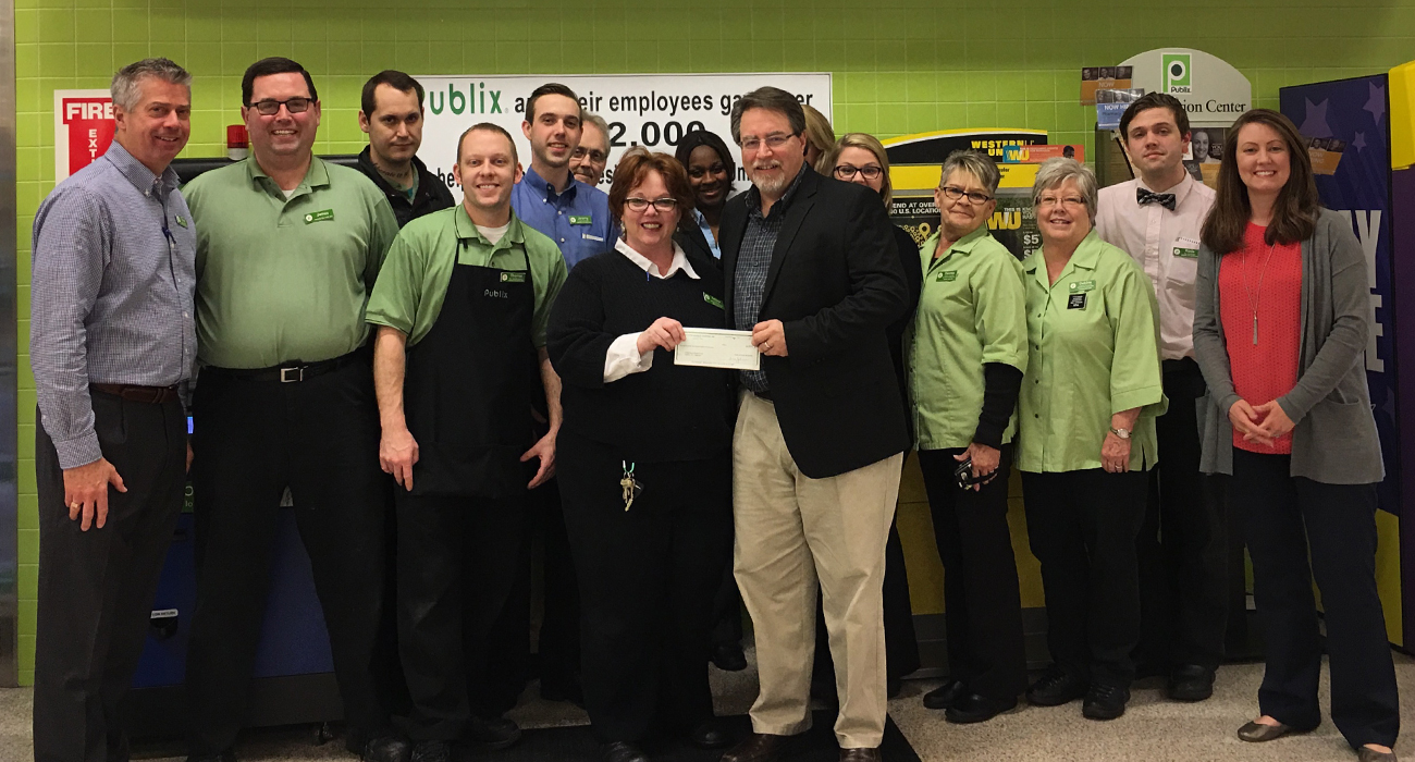 publix charities presents check to united way of wilson county