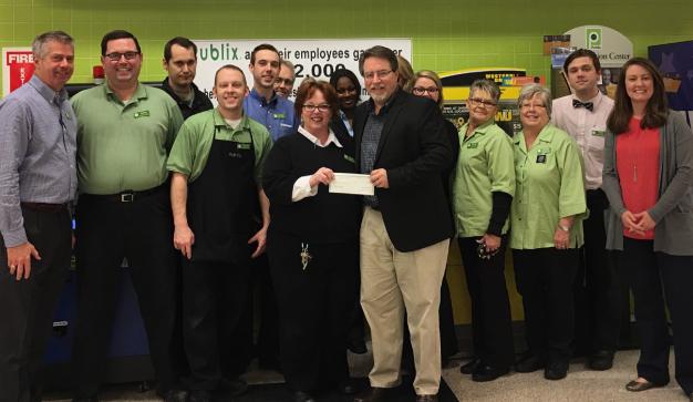 publix charities presents check to united way of wilson county