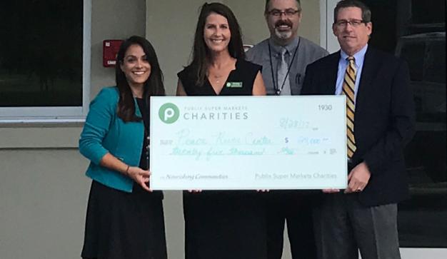 publix charities presents $25,000 check donation to Peace River Center