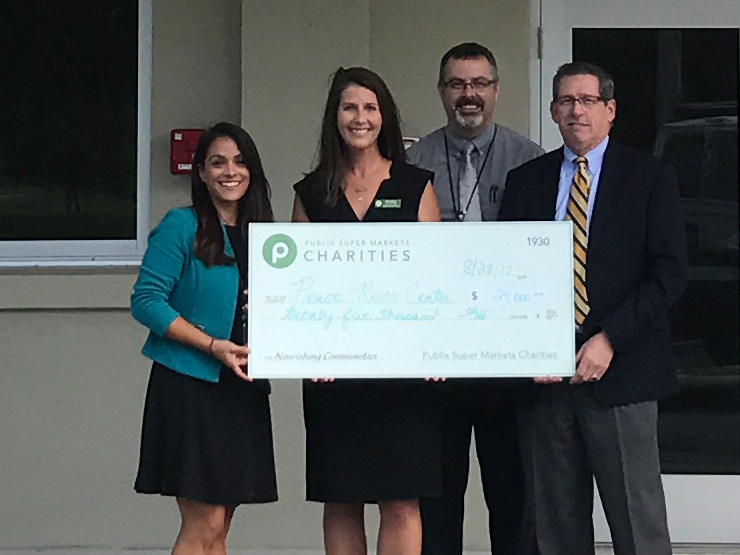 publix charities presents $25,000 check donation to Peace River Center