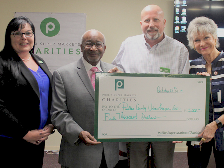 Publix Store Managers present Urban League of Pinellas County with a giant check.