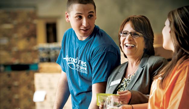 smiling food bank volunteers