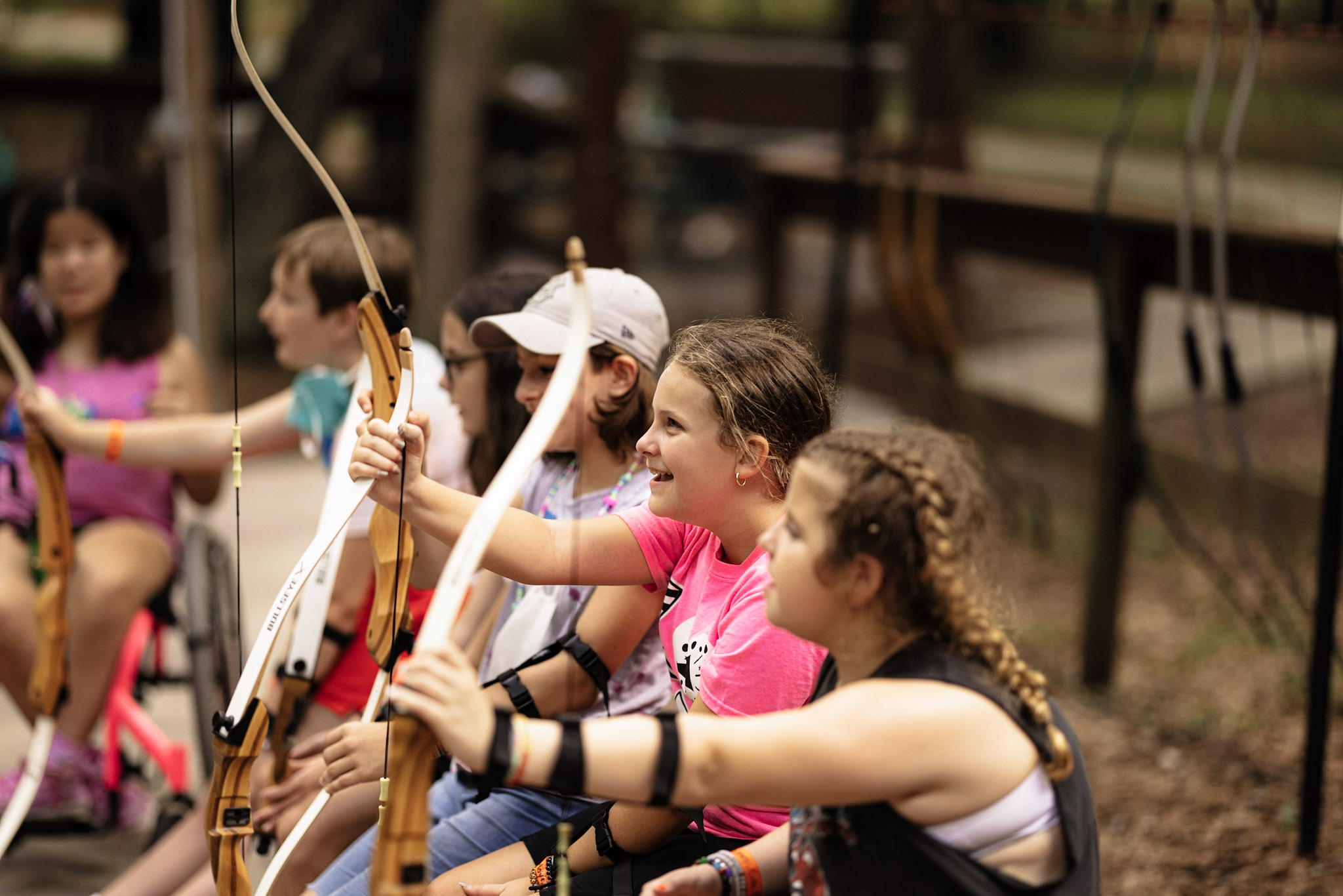 kids trying archery