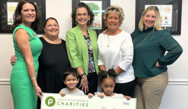 Publix charities check donation to Achievement Academy