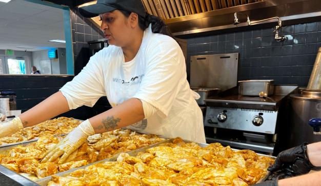 woman preparing a large dish