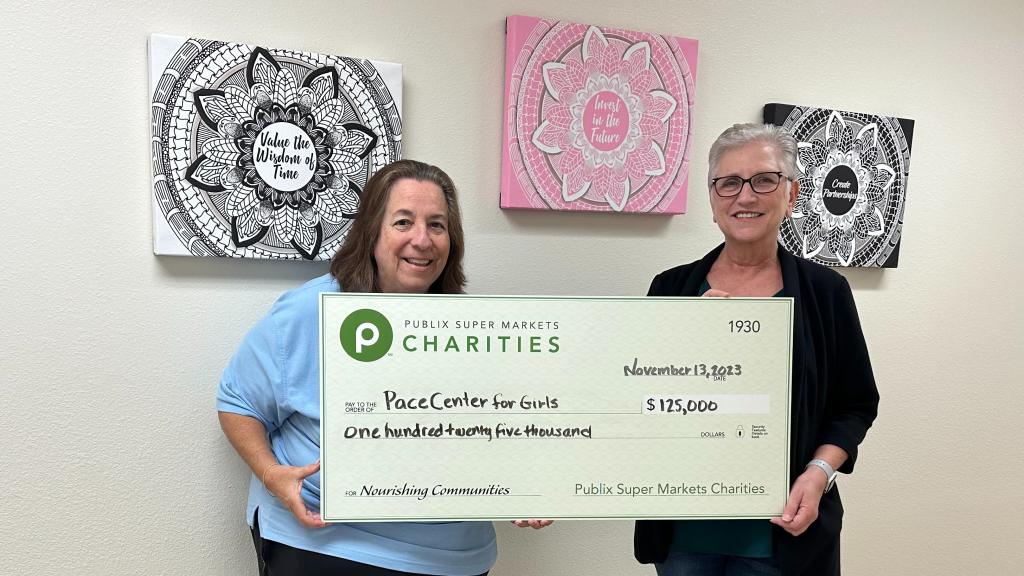 Two women holding a check for PACE Center for Girls