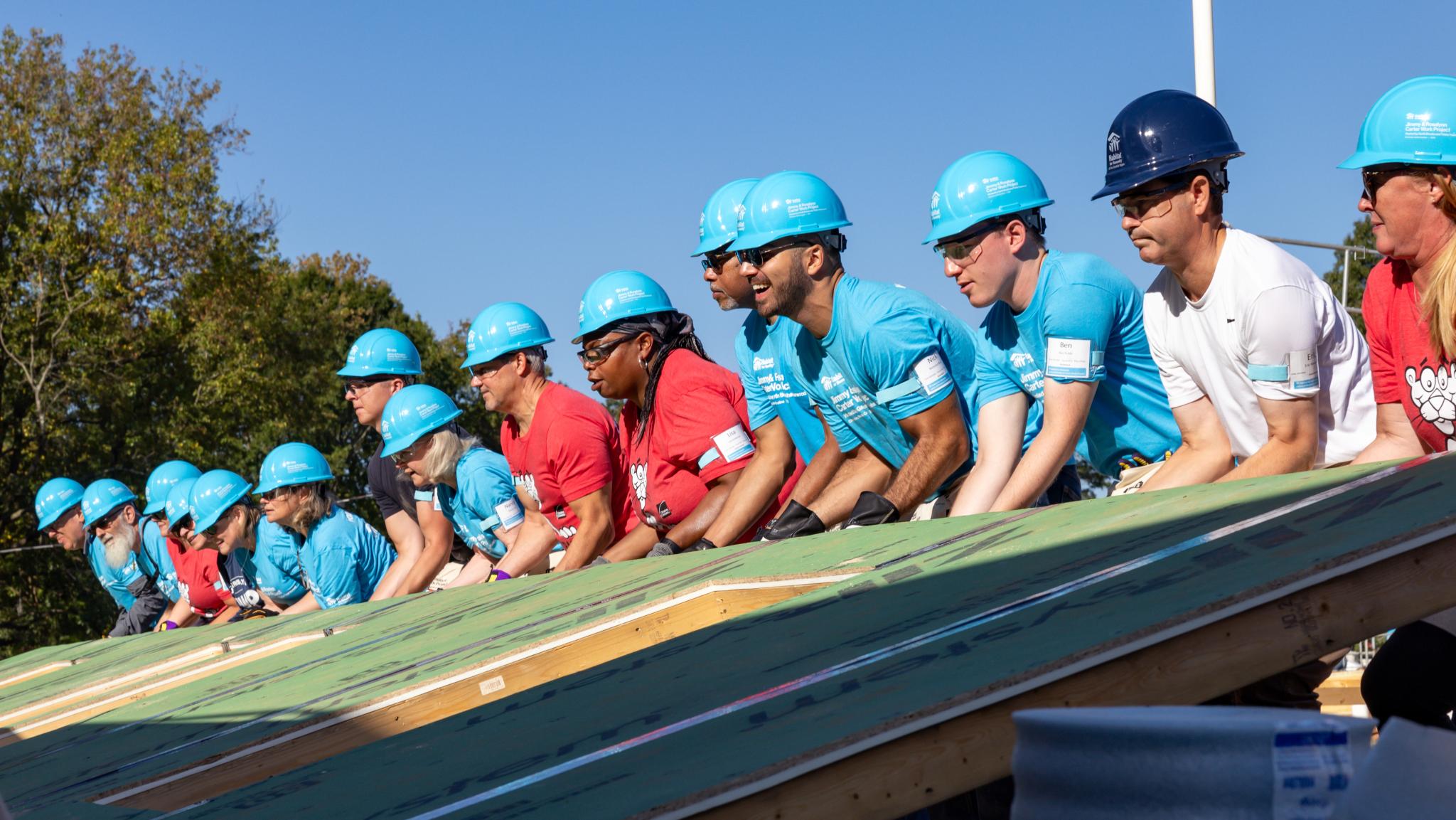 group helping to build a house