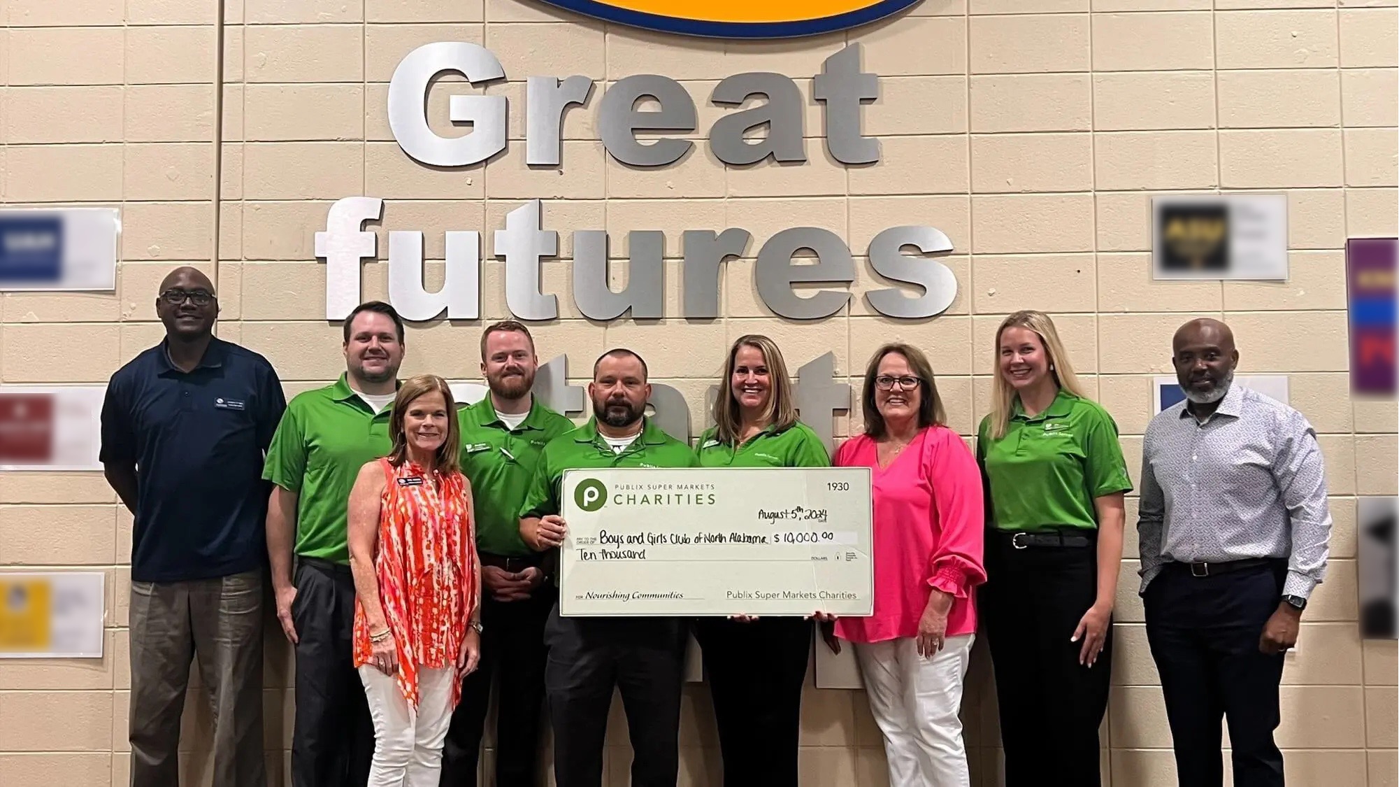 Publix store managers presenting charity check