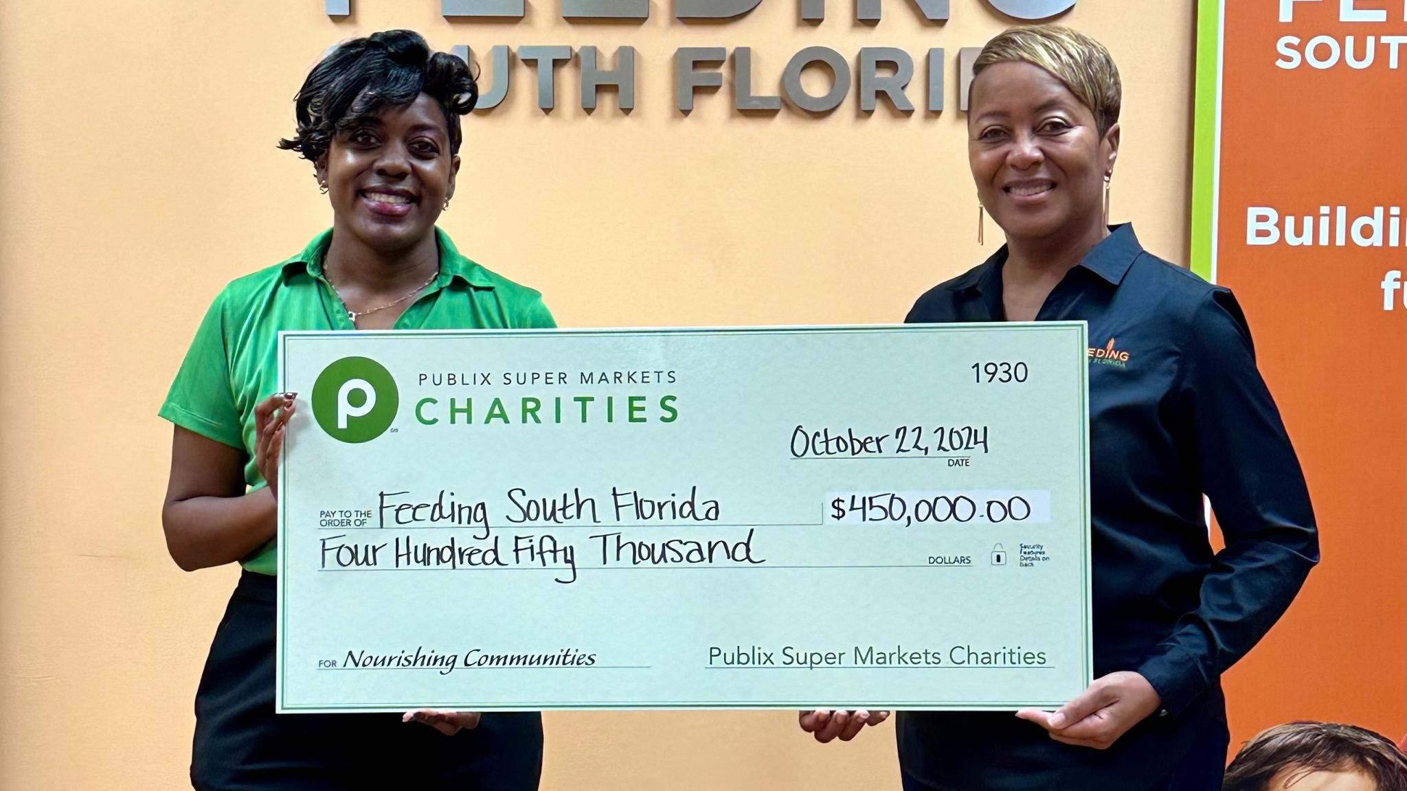 presenting a charity check to Feeding South Florida