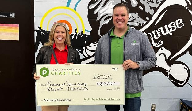 John Doran presenting a charity check for $80,000 to the Friends of Joshua House