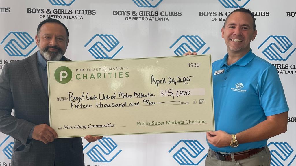 two men holding a giant Publix Charities check for the Boys & Girls Clubs of Metro Atlanta
