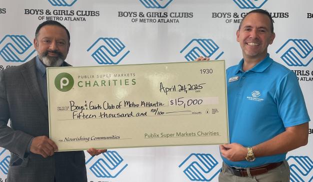 two men holding a giant Publix Charities check donation of $15,000 for the Boys & Girls Clubs of Metro Atlanta
