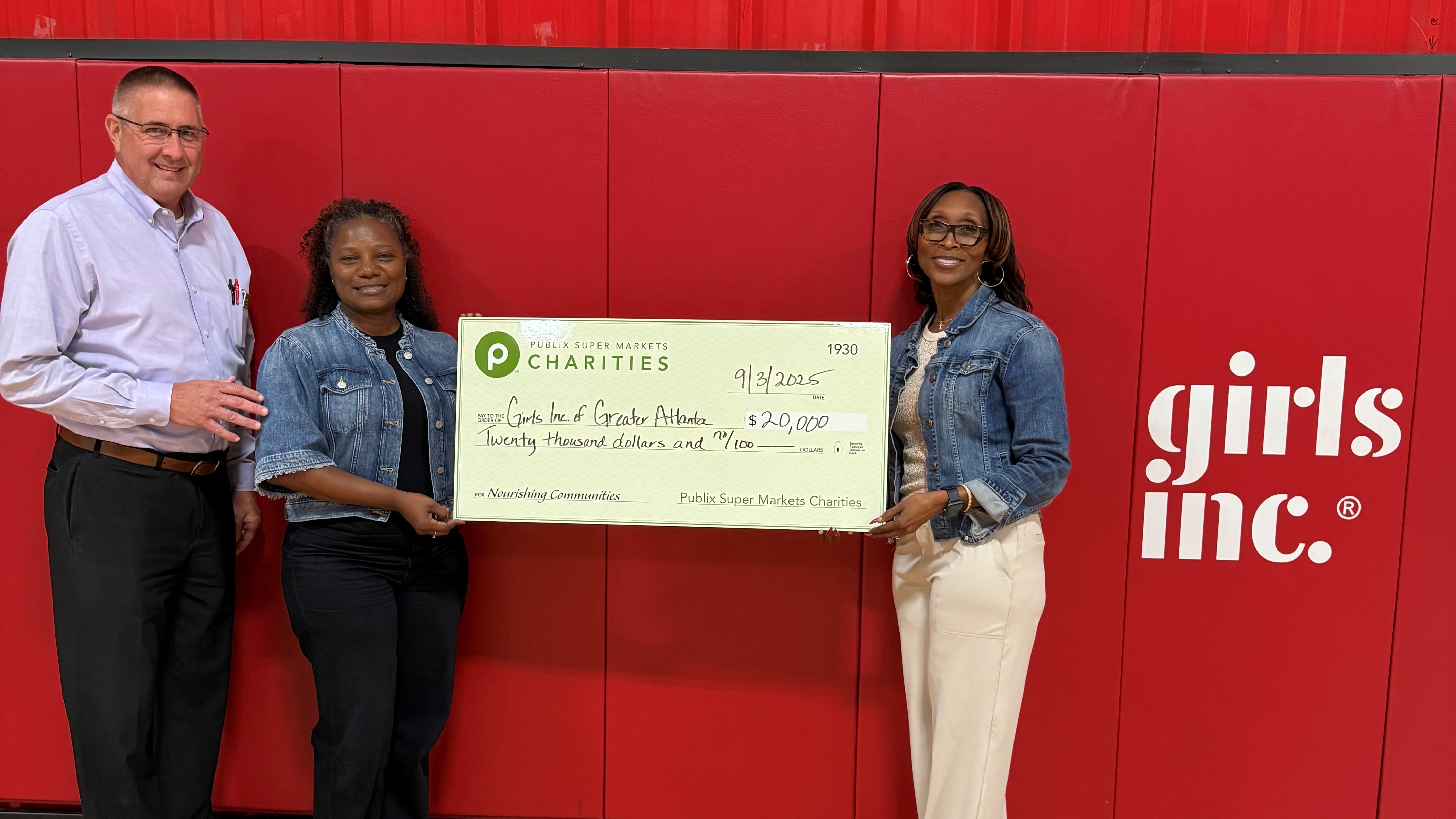 Presenting a charity check to Girls Inc. of Greater Atlanta