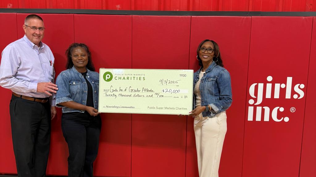 Presenting a charity check to Girls Inc. of Greater Atlanta