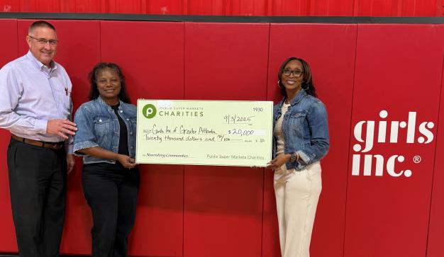 Presenting a charity check to Girls Inc. of Greater Atlanta