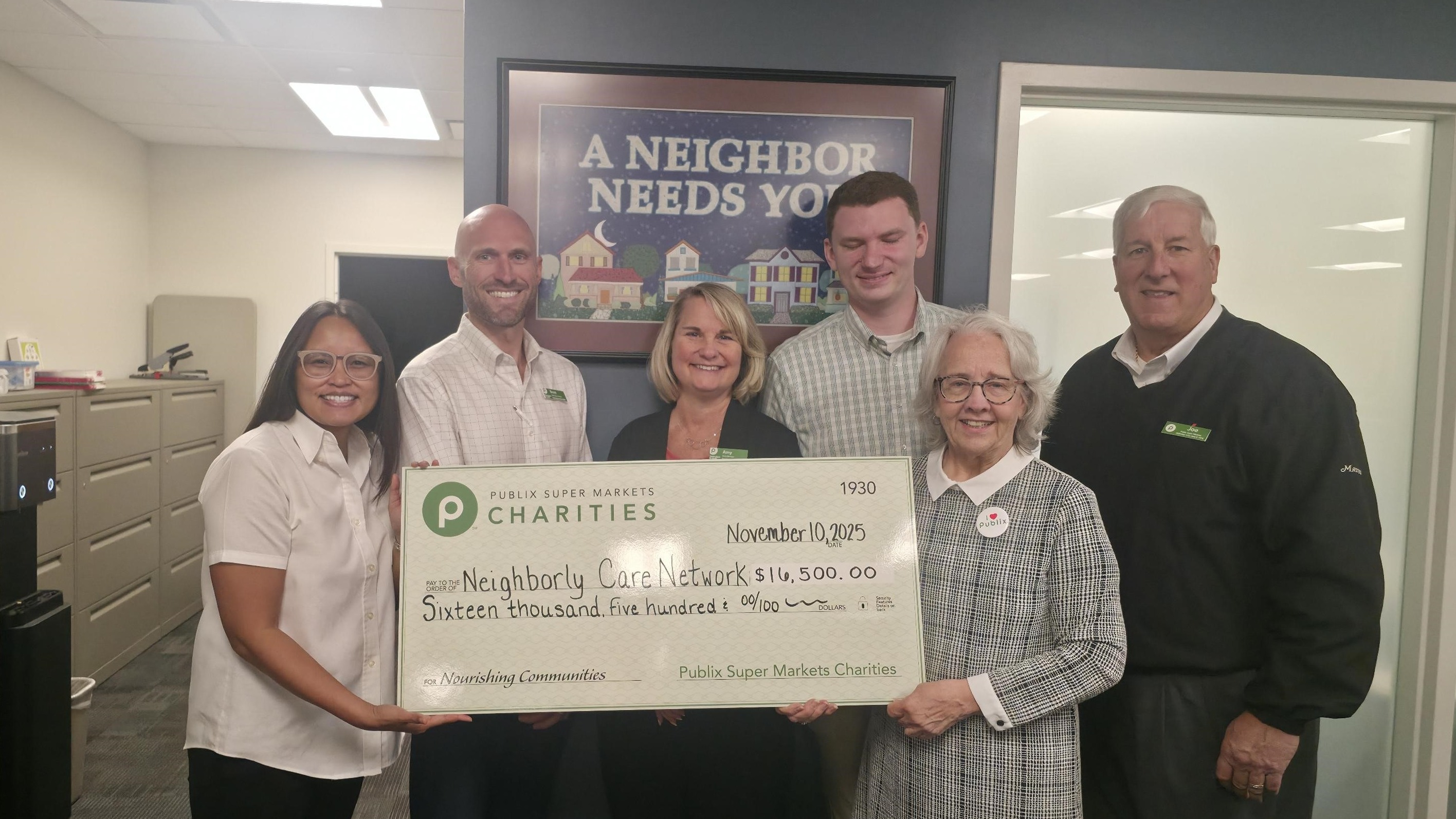 Presenting a charity check to Meals on Wheels of Pinellas County