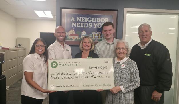 Presenting a charity check to Meals on Wheels of Pinellas County