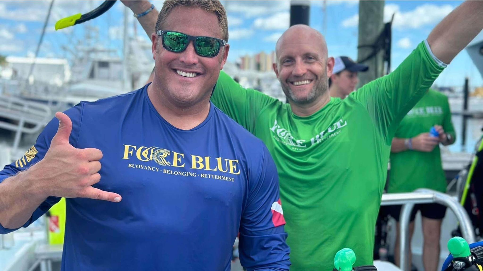 two volunteers for Force Blue smiling