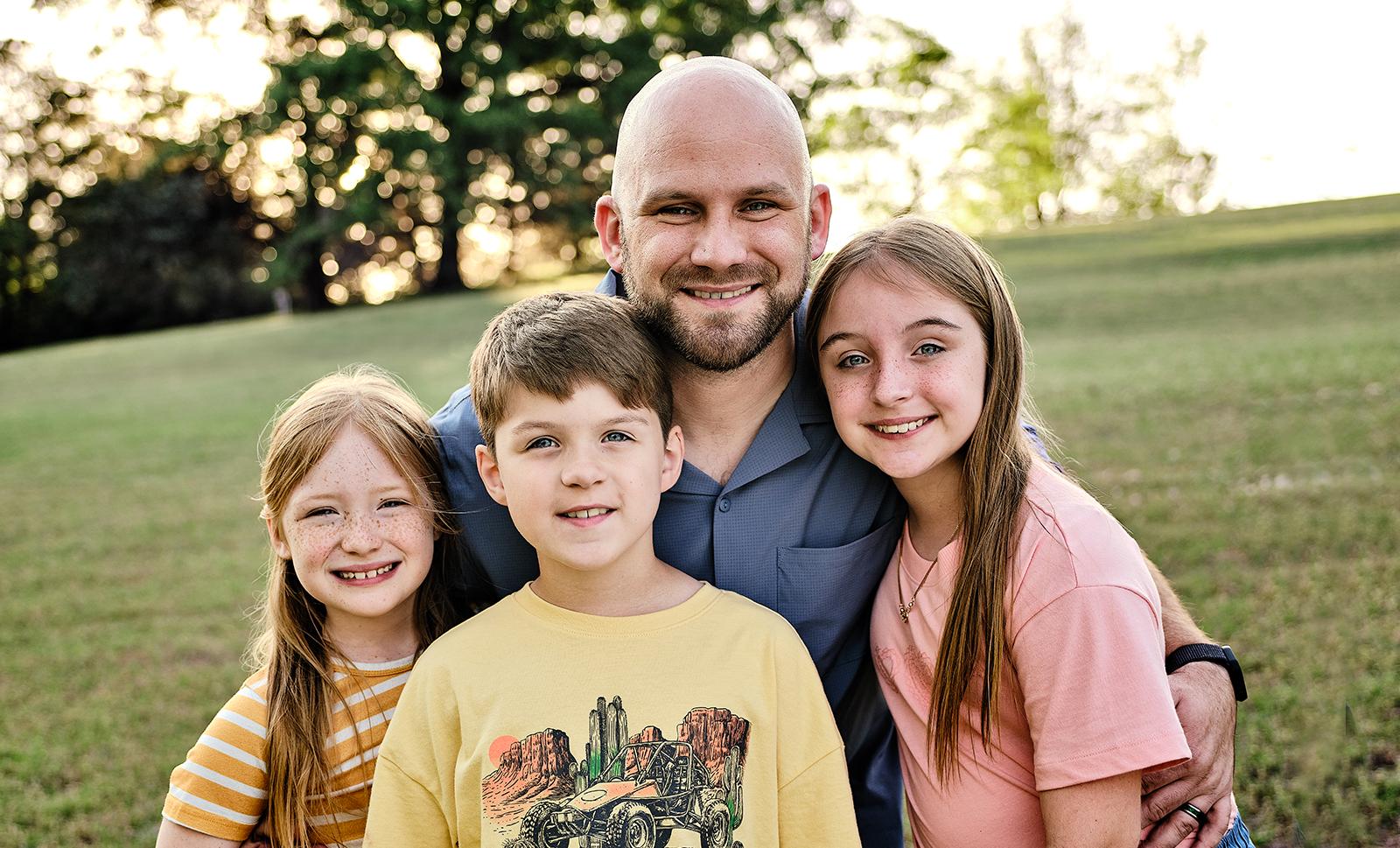 Kevin and his three children.