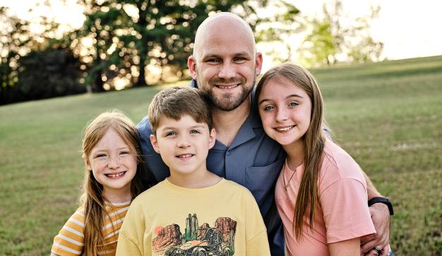 Kevin and his three children.
