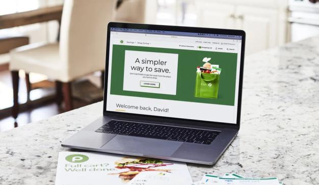 laptop with Publix banner on screen reading "A simpler way to save."
