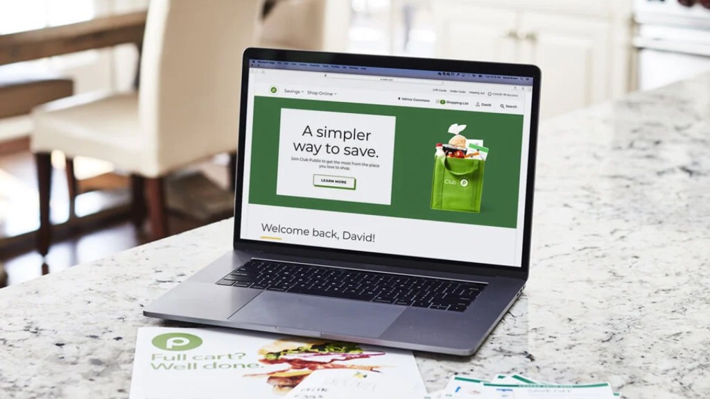 laptop with Publix banner on screen reading "A simpler way to save."