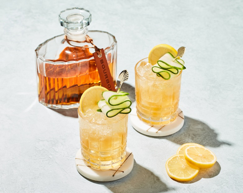 bottle of bourbon and fancy cocktails