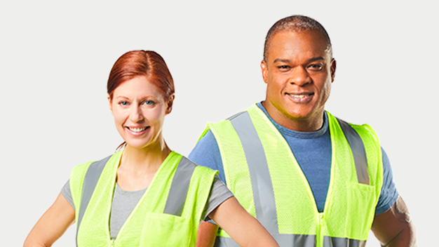 Woman and man wearing high visibility vests and smiling