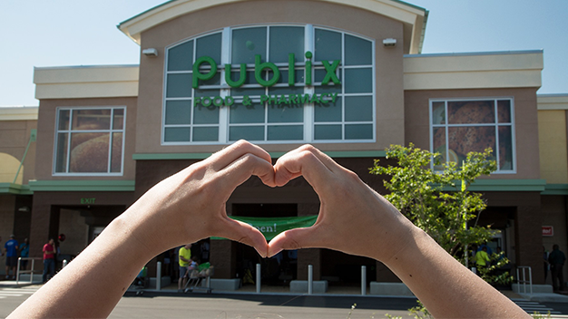heart hands in front of publix store