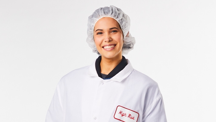 publix associate in white jacket and hairnet