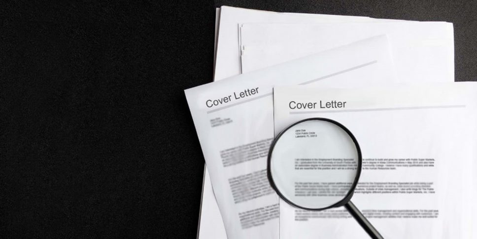 cover letter and magnifying glass