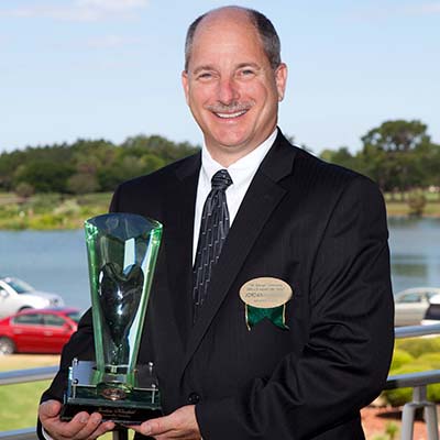 man holding an award