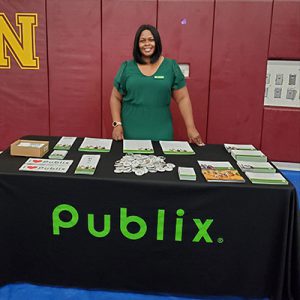 woman at a community outreach Publix table