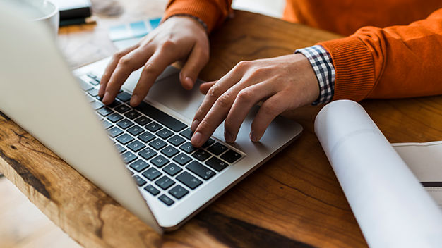 a person types on a computer