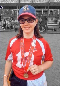 Maggie with a medal at the special Olympics