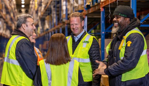 group of warehouse associates networking