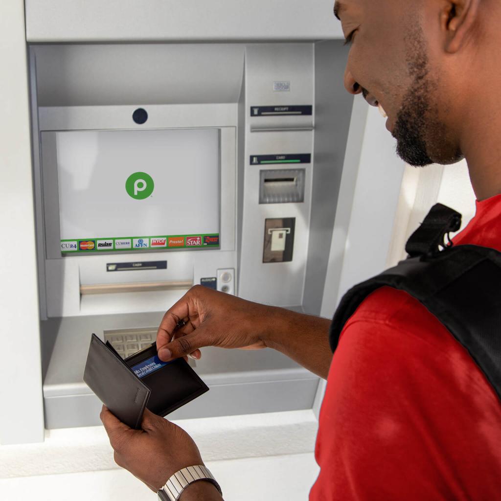 man using an ATM