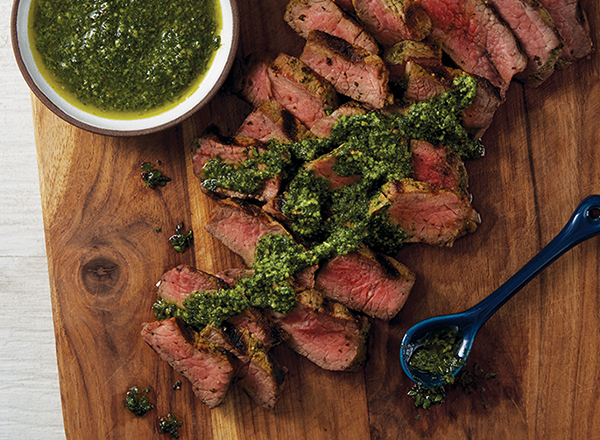 Image of grilled tri-tip steak with chimichurri