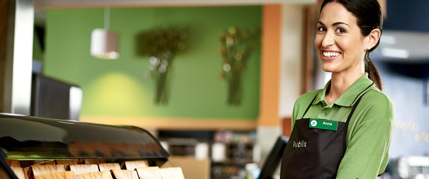a smiling publix associate