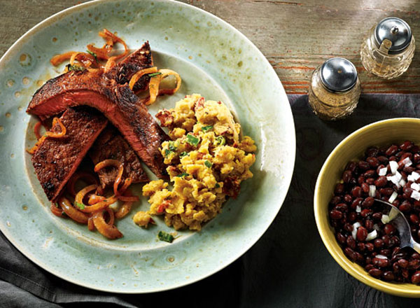 Image of Latin steak and onions with bacon tostones