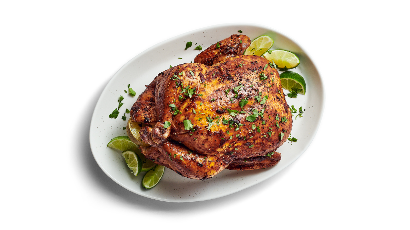 Whole Roasted Chicken with cilantro and lime garnish