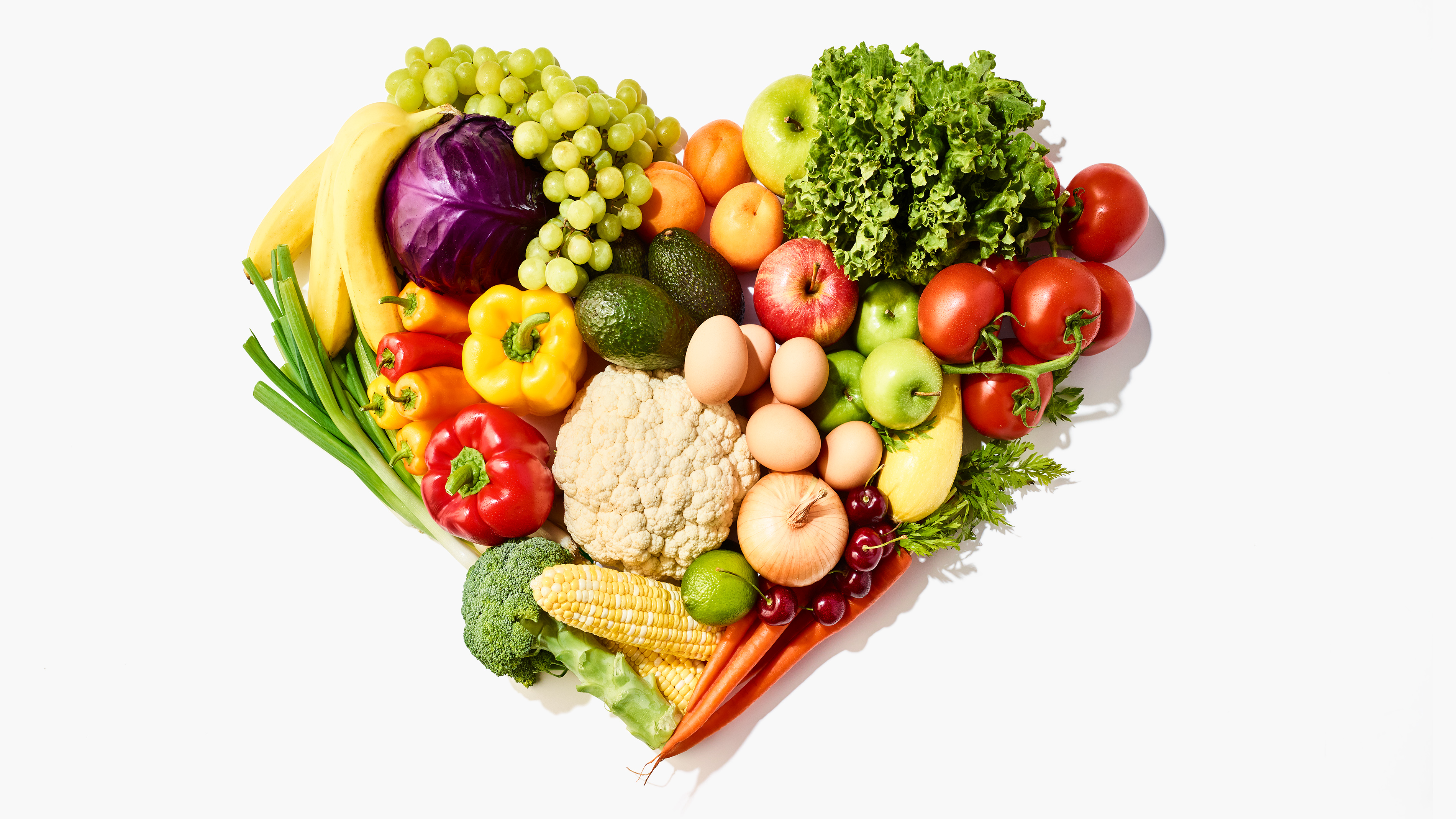 fresh fruits and vegetables making a heart